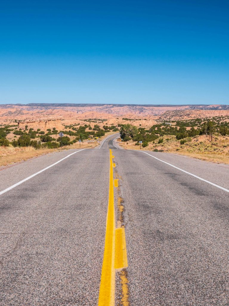 Empty two-lane road through the New Mexico desert